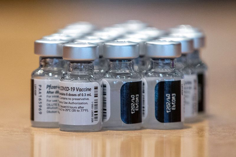 &copy; Reuters. Vials of the Pfizer/BioNTech coronavirus disease (COVID-19) vaccine, which was authorized by Canada to be used for children aged 12 to 15, are seen at Woodbine Racetrack pop-up vaccine clinic in Toronto, Ontario, Canada May 5, 2021. REUTERS/Carlos Osorio