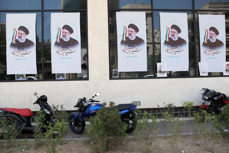 &copy; Reuters. FILE PHOTO: Posters of presidential candidate Ebrahim Raisi are seen at a campaign center in Tehran, Iran June 4, 2021. Majid Asgaripour/WANA (West Asia News Agency) via REUTERS  