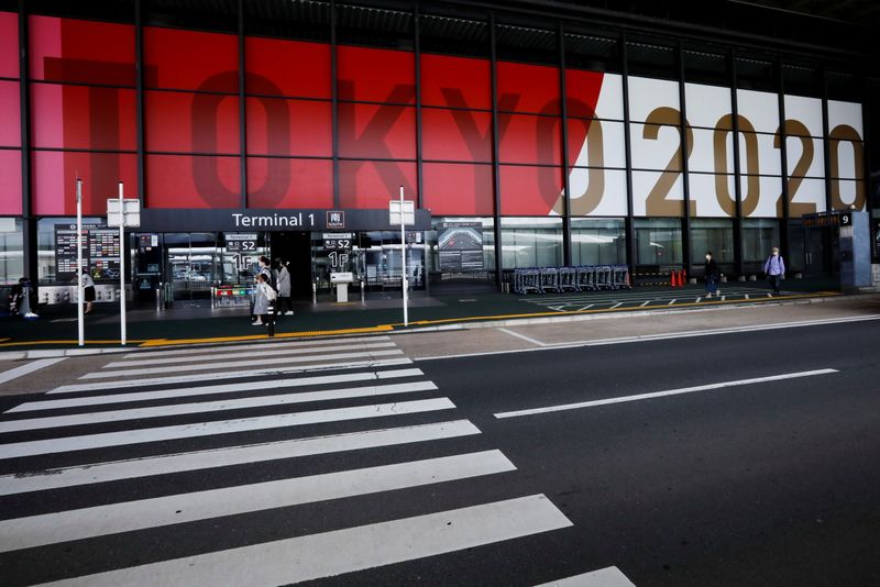 &copy; Reuters. FILE PHOTO: An advertisement for Tokyo 2020 Olympic and Paralympic Games is displayed at Narita international airport, amid the coronavirus disease (COVID-19) pandemic, in Narita, east of Tokyo, Japan June 1, 2021.  REUTERS/Issei Kato/File Photo