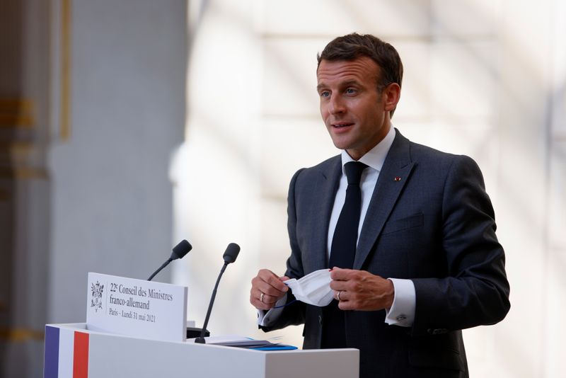 &copy; Reuters. FILE PHOTO: French President Emmanuel Macron speaks on during a press conference upon the 22nd German-French Ministerial Council videoconference at the Elysee presidential palace in Paris, France, May 31, 2021. Thomas Samson/Pool via REUTERS