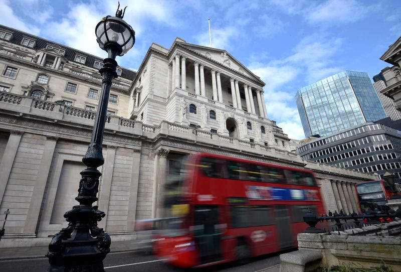 &copy; Reuters. FILE PHOTO: A bus passes the Bank of England in the City of London, Britain, February 14, 2017. REUTERS/Hannah McKay/File photo