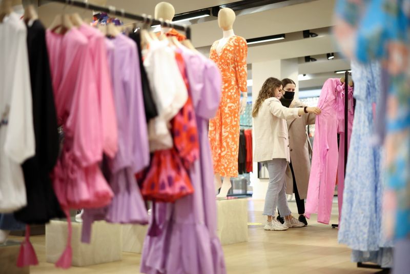 &copy; Reuters. FILE PHOTO: People shop in the Selfridges department store on Oxford street, as the coronavirus disease (COVID-19) restrictions ease, in London, Britain April 12, 2021. REUTERS/Henry Nicholls/File Photo