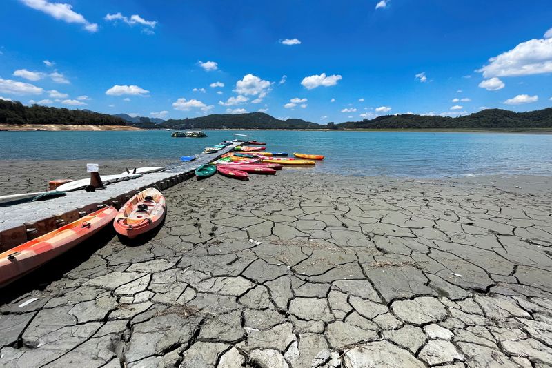 &copy; Reuters. FILE PHOTO: Boats sit at a pier on Sun Moon Lake with low water levels during an islandwide drought, in Nantou, Taiwan May 15, 2021. REUTERS/Annabelle Chih/File Photo