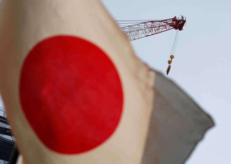 &copy; Reuters. A crane at a construction site is seen behind Japan's national flag in Tokyo, Japan, August 12, 2016. REUTERS/Kim Kyung-Hoon/Files