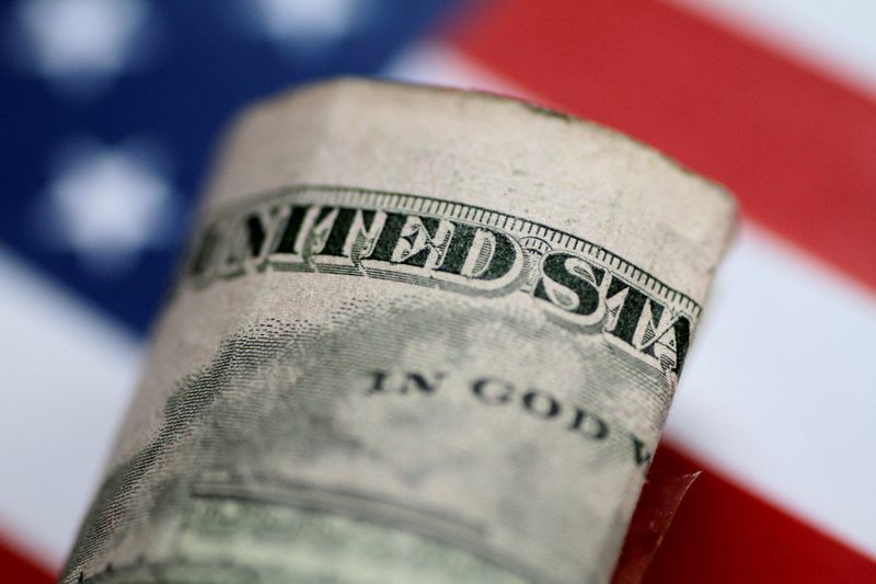 FX volatility low, dollar up slightly as investors wait on inflation