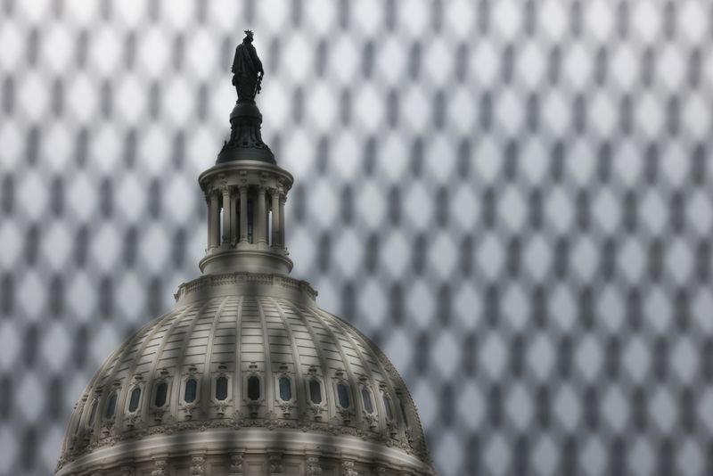 &copy; Reuters. FILE PHOTO: The U.S. Capitol building is seen behind security fencing that has been up around the building since shortly after the January 6, 2021 siege on Capitol Hill in Washington, May 28, 2021.  REUTERS/Evelyn Hockstein