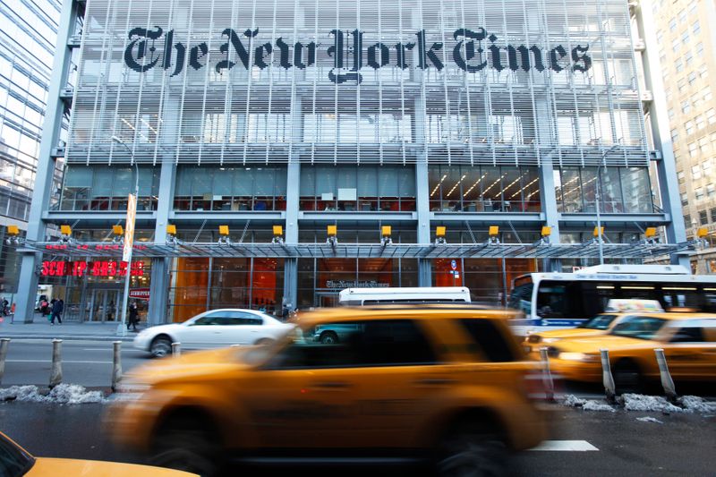&copy; Reuters. Vehicles drive past the New York Times headquarters in New York March 1, 2010. Shares of the U.S. media company rose to an intraday high of $12.16 on Monday, up more than 11 percent, propelled by a rumor that Mexican billionaire Carlos Slim was seeking to