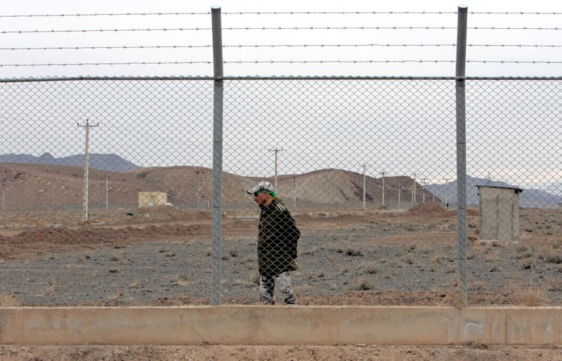 &copy; Reuters. FILE PHOTO: An Iranian soldier stands guard inside the Natanz uranium enrichment facility, 322km (200 miles) south of Iran's capital Tehran March 9, 2006.REUTERS/Raheb Homavandi