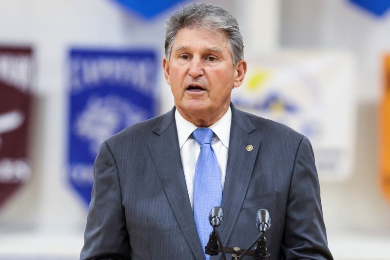 &copy; Reuters. FILE PHOTO: Sen. Joe Manchin, D-WV., speaks during a visit of U.S. first lady Jill Biden to a vaccination centre at Capital High School in Charleston, West Virginia, U.S., May 13, 2021.  Oliver Contreras/Pool via REUTERS/File Photo