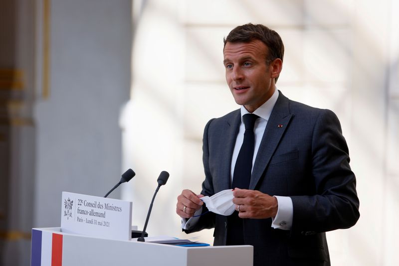 &copy; Reuters. FILE PHOTO: French President Emmanuel Macron speaks during a press conference upon the 22nd German-French Ministerial Council videoconference at the Elysee presidential palace in Paris, France, May 31, 2021. Thomas Samson/Pool via REUTERS