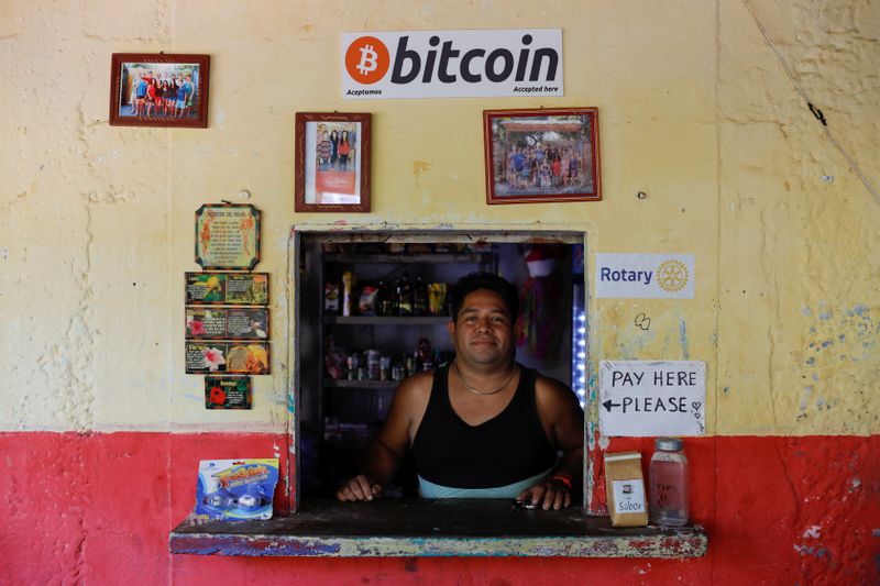 © Reuters. Roberto Carlos Silva, owner of La Zontena store, poses at his business where he accepts Bitcoins at El Zonte Beach in Chiltiupan, El Salvador June 8, 2021. REUTERS/Jose Cabezas