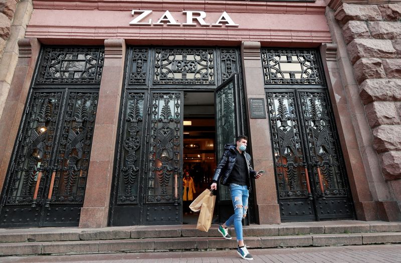 &copy; Reuters. FILE PHOTO: A man wearing a protective face mask, used as a preventive measure against the coronavirus disease (COVID-19), walks out of a Zara store in central Kyiv, Ukraine November 25, 2020. REUTERS/Valentyn Ogirenko/File Photo  GLOBAL BUSINESS WEEK AHE