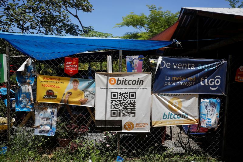 &copy; Reuters. FILE PHOTO: Bitcoin banners are seen outside of a small restaurant at El Zonte Beach in Chiltiupan, El Salvador June 8, 2021. REUTERS/Jose Cabezas/File Photo