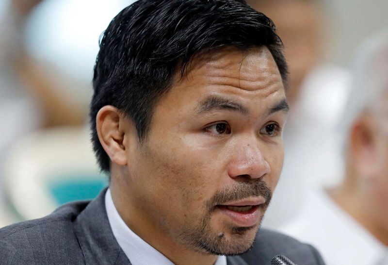 &copy; Reuters. FILE PHOTO: Philippine Senator and boxer Manny Pacquiao speaks during the Congressional confirmation hearing of Environment Secretary Regina Lopez at the Senate in Manila, Philippines May 2, 2017.  REUTERS/Erik De Castro