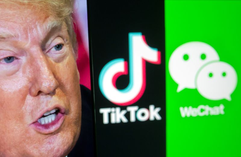 &copy; Reuters. A picture of U.S. President Donald Trump is seen on a smartphone in front of displayed Tik Tok and WeChat logos in this illustration taken September 18, 2020. REUTERS/Dado Ruvic/Illustration