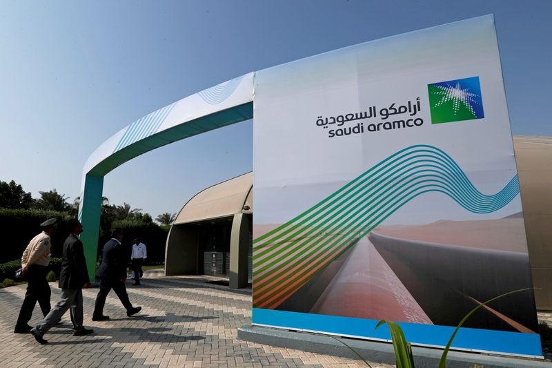 &copy; Reuters. FILE PHOTO: The logo of Aramco is seen as security personnel walk before the start of a press conference by Aramco at the Plaza Conference Center in Dhahran, Saudi Arabia November 3, 2019. REUTERS/Hamad I Mohammed/File Photo