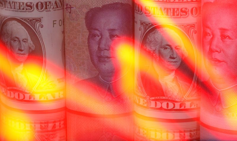 &copy; Reuters. Chinese Yuan and U.S. dollar banknotes are seen behind illuminated stock graph in this illustration taken February 10, 2020. REUTERS/Dado Ruvic/Illustration