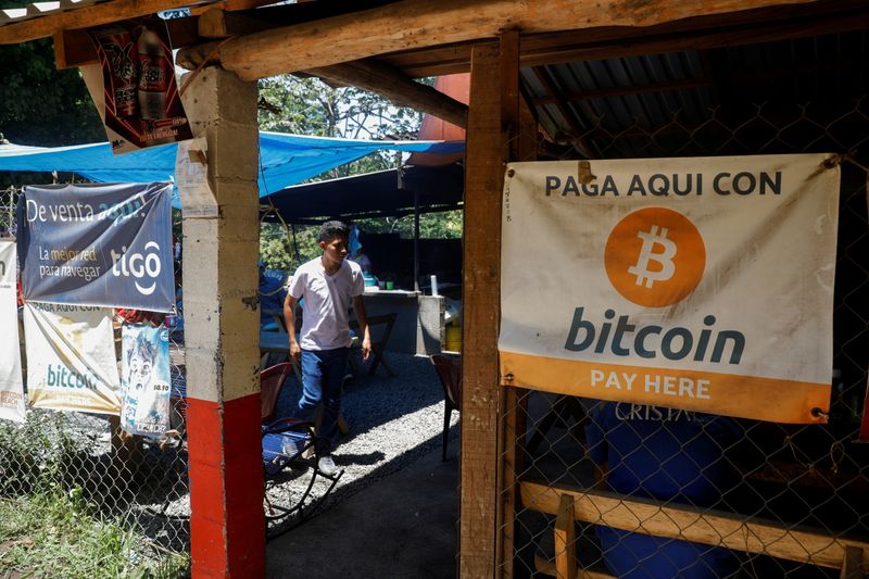 &copy; Reuters. FILE PHOTO: Bitcoin banners are seen outside of a small restaurant at El Zonte Beach in Chiltiupan, El Salvador June 8, 2021. REUTERS/Jose Cabezas