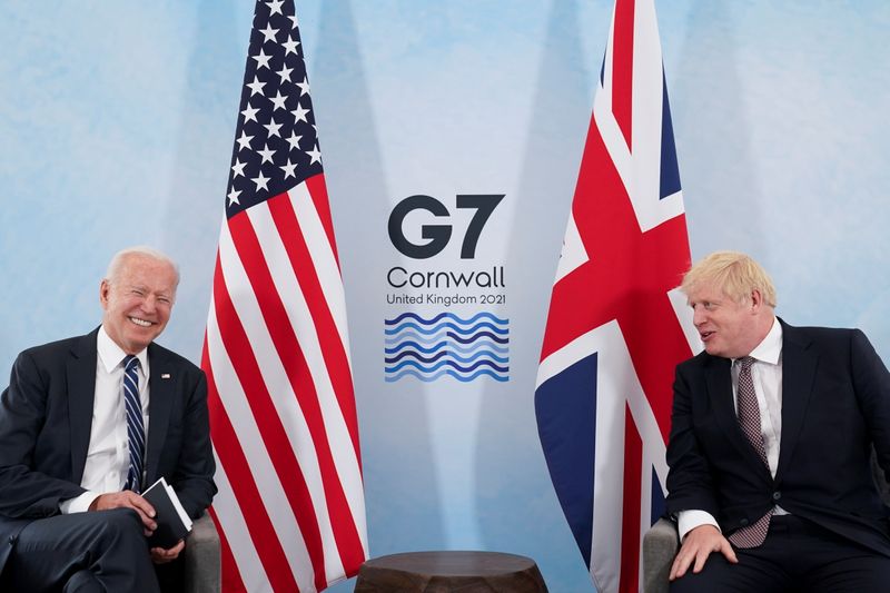 &copy; Reuters. U.S. President Joe Biden laughs while speaking with Britain's Prime Minister Boris Johnson during their meeting, ahead of the G7 summit, at Carbis Bay, Cornwall, Britain June 10, 2021REUTERS/Kevin Lamarque
