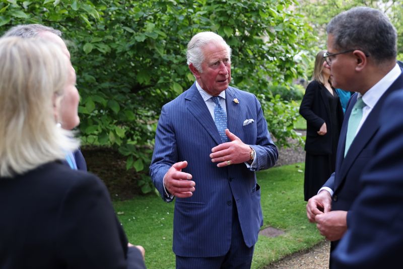 © Reuters. Britain's Prince Charles speaks with Rt Hon Alok Sharma after announcing the Terra Carta Transition Coalitions, an organized, global collective working together to drive investment towards a sustainable future for Nature, People and Planet as a meeting and Coalitions' announcement form part of the wider G7 activity, at St James Palace, in London, Britain June 10, 2021. Chris Jackson/Pool via REUTERS