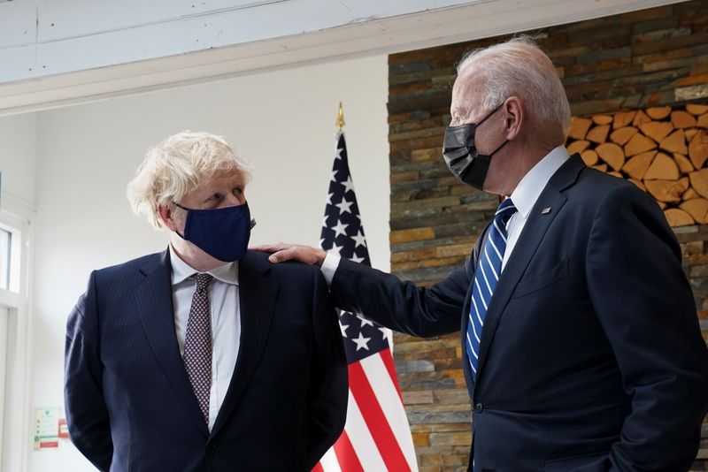 &copy; Reuters. U.S. President Joe Biden speaks with Britain's Prime Minister Boris Johnson, as they look at historical documents and artefacts relating to the Atlantic Charter during their meeting, at Carbis Bay Hotel, Carbis Bay, Cornwall, Britain June 10, 2021 REUTERS