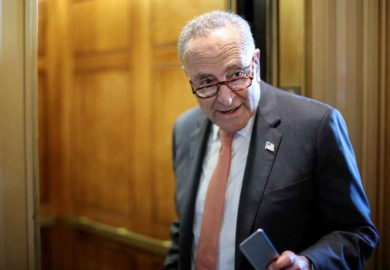 © Reuters. FILE PHOTO: U.S. Senate Majority Leader Chuck Schumer (D-NY) speaks to a reporter about the status of a deal on infrastructure legislation as he departs the Senate floor at the U.S. Capitol in Washington, U.S., June 8, 2021. REUTERS/Jonathan Ernst