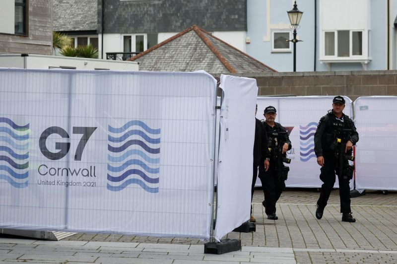 &copy; Reuters. Armed police officers walk in Falmouth as preparations are underway for the G7 leaders summit, Cornwall, Britain, June 10, 2021. REUTERS/Phil Noble