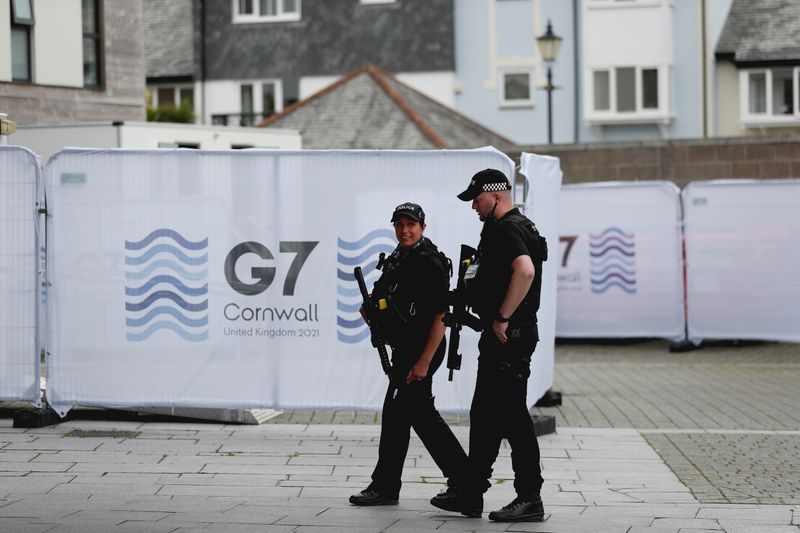 &copy; Reuters. Police officers walk outside the National Maritime Museum as preparations are underway for the G7 leaders summit, Falmouth, Cornwall, Britain, June 10, 2021. REUTERS/Peter Nicholls