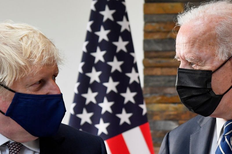&copy; Reuters. U.S. President Joe Biden speaks with Britain's Prime Minister Boris Johnson, as they look at historical documents and artefacts relating to the Atlantic Charter during their meeting, at Carbis Bay Hotel, Carbis Bay, Cornwall, Britain June 10, 2021. REUTER