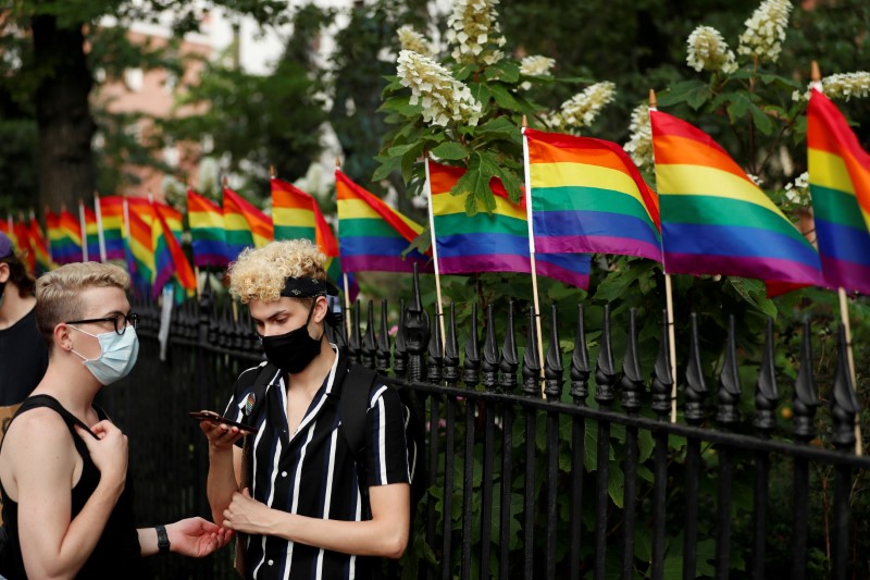 &copy; Reuters. FILE PHOTO: Demonstrators take a moment while listening to speakers voice their support for gay pride and black lives matter movements in New York City, New York, U.S., June 25, 2020. REUTERS/Lucas Jackson/File Photo