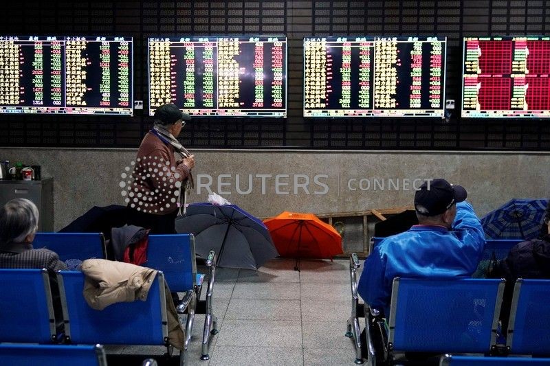 &copy; Reuters. Corretora em Xangai. REUTERS/Aly Song