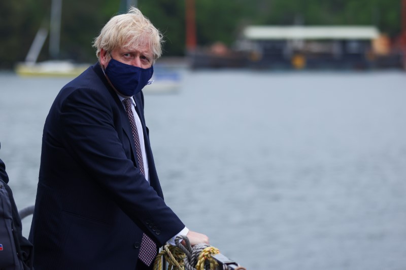 &copy; Reuters. Britain's Prime Minister Boris Johnson arrives by boat to visit the workshop of Scott Woyka, ahead of the G7 summit, in Falmouth, Cornwall, Britain June 10, 2021. REUTERS/Tom Nicholson/Pool