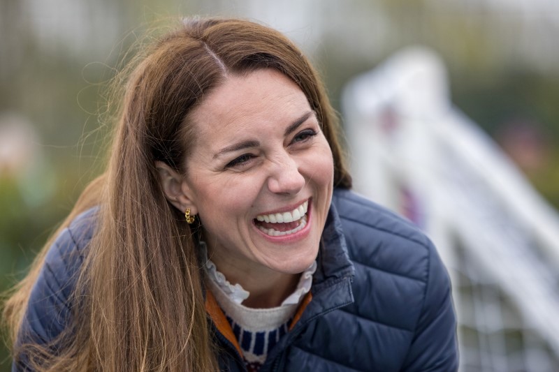 &copy; Reuters. FILE PHOTO: Britain's Catherine, Duchess of Cambridge, laughs with youth supported by the Cheesy Waffles Project, a charity for children, young people and adults with additional needs across County Durham, at the Belmont Community Centre, Britain April 27