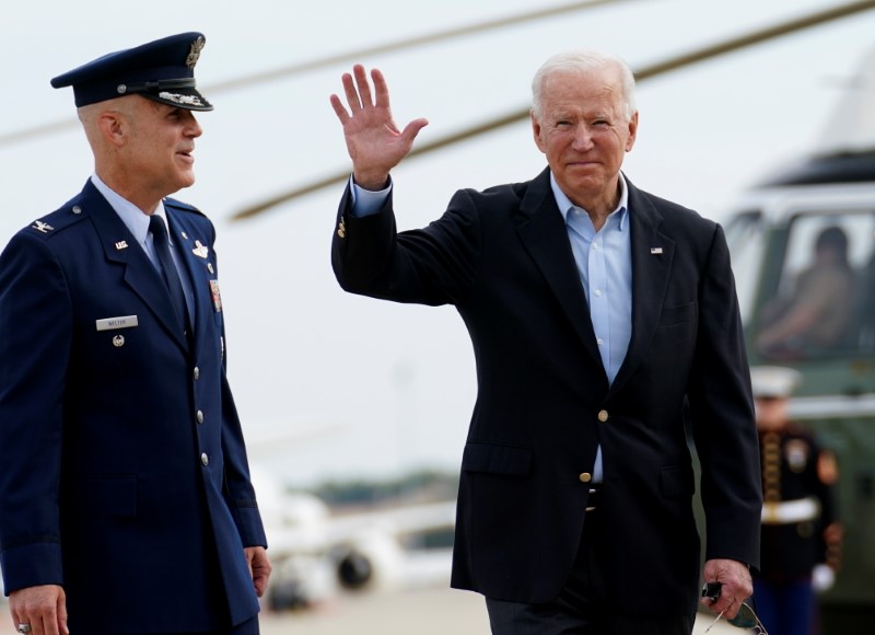 &copy; Reuters. FILE PHOTO: U.S. President Joe Biden waves prior to boarding Air Force One for travel to attend the G-7 Summit in England, the first foreign trip of his presidency, as U.S. Colonel Tim Welter stands by at Joint Base Andrews, Maryland, U.S., June 9, 2021. 