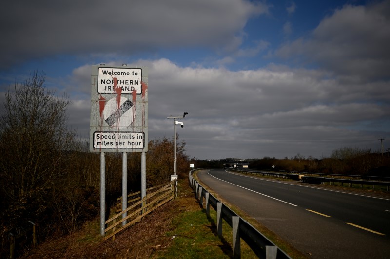 &copy; Reuters. FILE PHOTO: A defaced 'Welcome to Northern Ireland' sign is seen on the Ireland and Northern Ireland border reminding motorists that the speed limits will change from kilometres per hour to miles per hour on the border in Carrickcarnan, Ireland, March 6, 