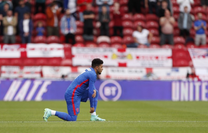 &copy; Reuters. FILE PHOTO: Soccer Football - International Friendly - England v Romania - Riverside Stadium, Middlesbrough, Britain - June 6, 2021 England's Jadon Sancho kneels in support of the Black Lives Matter campaign before the match Pool via REUTERS/Lee Smith