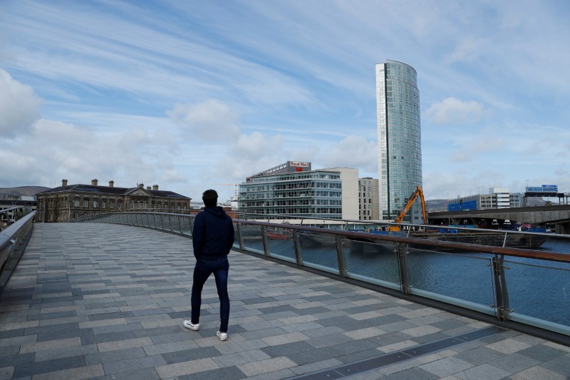 © Reuters. FILE PHOTO: A person is seen in Belfast Harbour, Northern Ireland, April 6, 2020. REUTERS/Jason Cairnduff