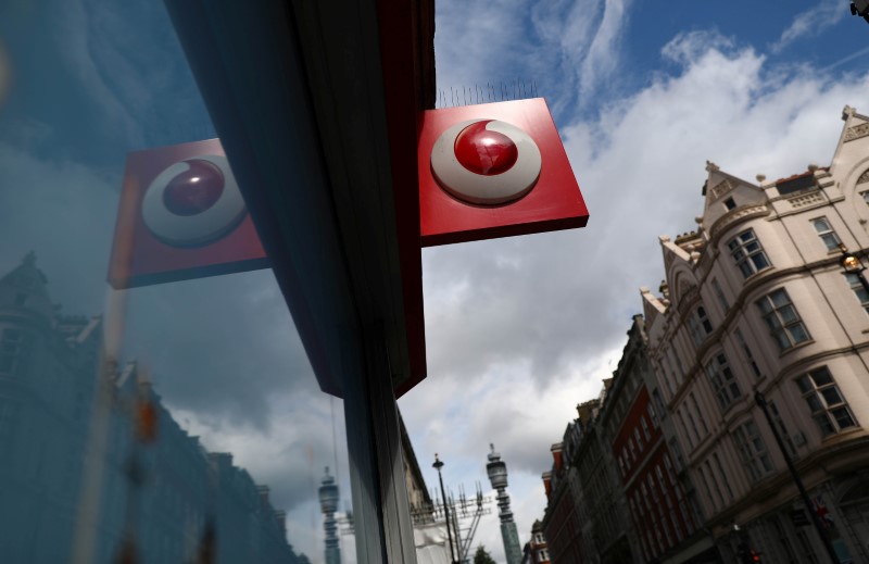 &copy; Reuters. FILE PHOTO:  A branded sign is displayed on a Vodafone  store in London, Britain May 16, 2017. REUTERS/Neil Hall/File photo