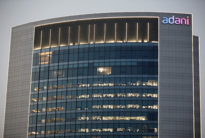 &copy; Reuters. The logo of the Adani Group is seen on the facade of one of its buildings on the outskirts of Ahmedabad, India, April 13, 2021. REUTERS/Amit Dave/Files