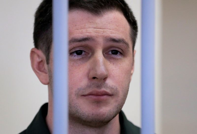 &copy; Reuters. FILE PHOTO: Former U.S. Marine Trevor Reed, who was detained in 2019 and accused of assaulting police officers, stands inside a defendants' cage during a court hearing in Moscow, Russia March 11, 2020. REUTERS/Tatyana Makeyeva/File Photo