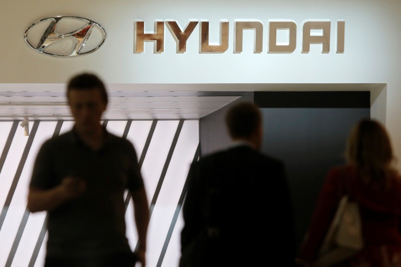 &copy; Reuters. People walk past the logo of Hyundai on the car maker's booth at the 2016 Moscow International Auto Salon in Moscow, Russia, August 24, 2016. REUTERS/Maxim Shemetov