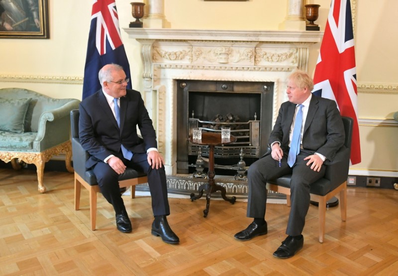 © Reuters. Britain's Prime Minister Boris Johnson and Australia's Prime Minister Scott Morrison speak at 10 Downing Street, ahead of a meeting to formally announce a trade deal, in London, Britain, June 15, 2021. Dominic Lipinski/PA Wire/Pool via REUTERS