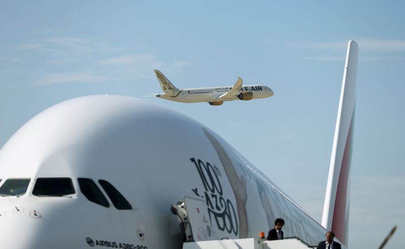 © Reuters. FILE PHOTO: Gulf Air Boeing 787-9 Dreamliner aircraft makes a fly-by as Emirates Airlines Airbus A380-800 plane is seen during the Bahrain International Air Show 2018, at Sakhir Air Base, south of Manama, Bahrain, November 14, 2018. Picture taken November 14, 2018. REUTERS/ Hamad I Mohammed/File Photo