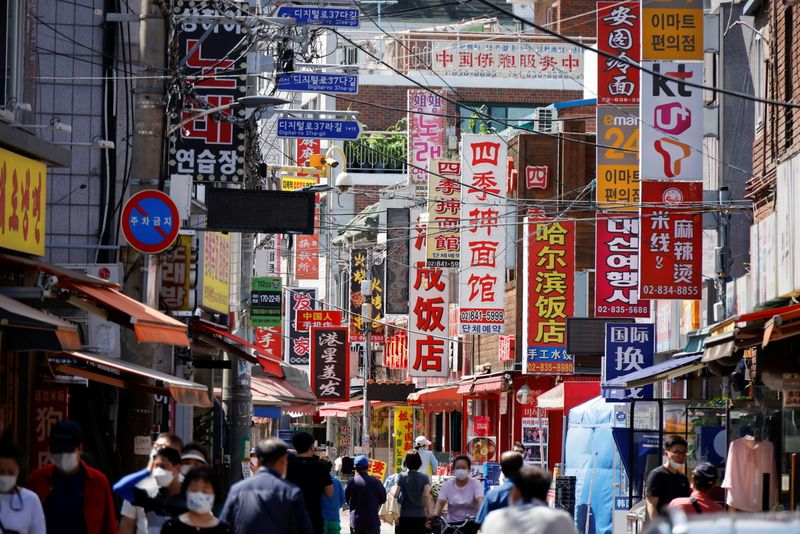 &copy; Reuters. Residents walk in Seoul's Chinatown neighbourhood, June 16, 2021.   REUTERS/Kim Hong-Ji
