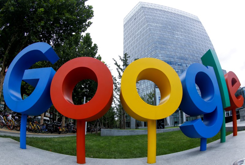 &copy; Reuters. FILE PHOTO: The brand logo of Alphabet Inc's Google is seen outside the company's office in Beijing, China, August 8, 2018.  Picture taken with a fisheye lens. REUTERS/Thomas Peter