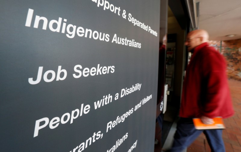 &copy; Reuters. FILE PHOTO: A man walks into a Centrelink, part of the Australian government's department of human services where job seekers search for employment, in a Sydney suburb, August 7, 2014. REUTERS/Jason Reed/File Photo