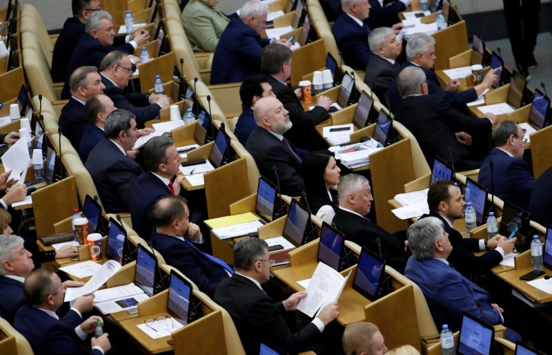 &copy; Reuters. FILE PHOTO: Pavel Krasheninnikov and other members of Russia's lower house of parliament, also known as the State Duma, attend a session to consider constitutional changes proposed by President Vladimir Putin in Moscow, Russia March 10, 2020. REUTERS/Evge