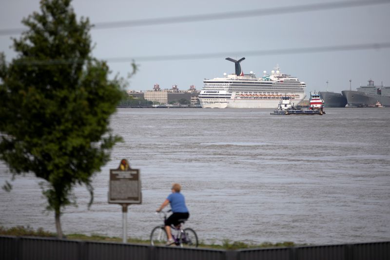 &copy; Reuters. FILE PHOTO: The Carnival Valor cruise ship, which is housing crew members only, is docked in its home port of New Orleans, Louisiana, U.S., amid the outbreak of the coronavirus disease (COVID-19), April 12, 2020.  REUTERS/Kathleen Flynn/File Photo