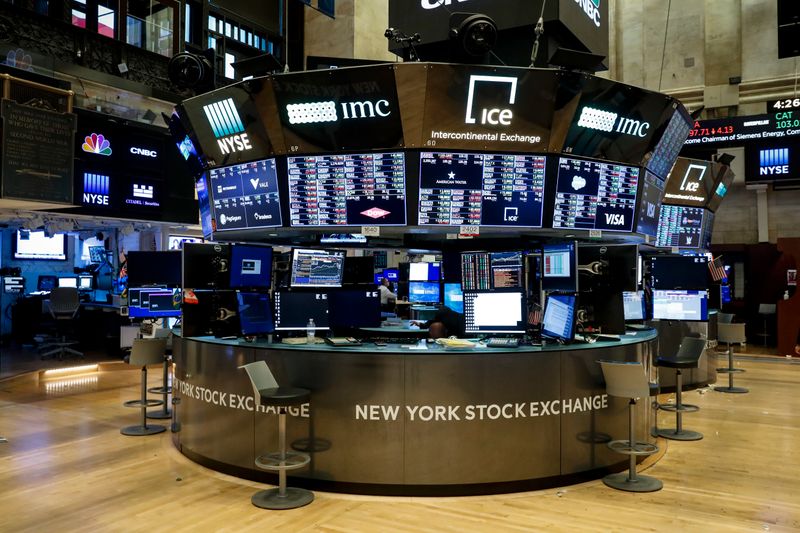 &copy; Reuters. FILE PHOTO: Floor traders work space is seen on the trading floor after the closing bell at the New York Stock Exchange (NYSE) in New York, U.S., March 19, 2020. REUTERS/Lucas Jackson