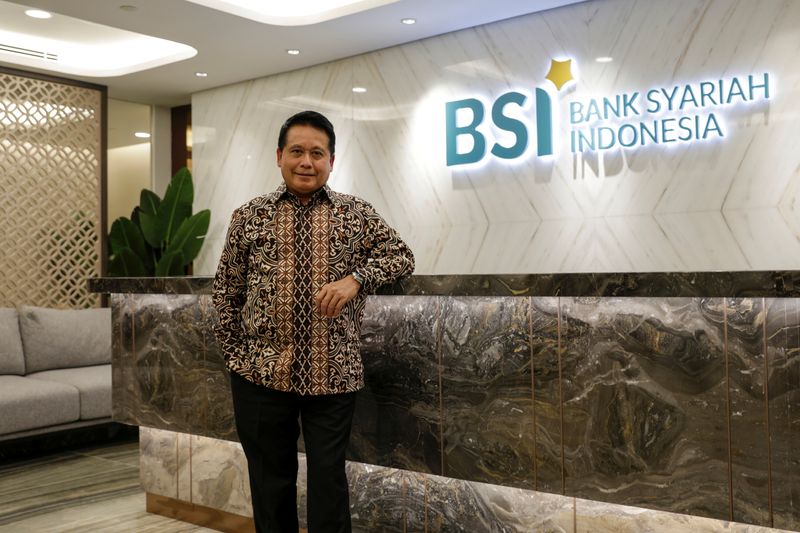 &copy; Reuters. FILE PHOTO: Bank Syariah Indonesia's President Director Hery Gunardi poses for pictures after an online interview in Jakarta, Indonesia, June 7, 2021. Picture taken June 7, 2021. REUTERS/Willy Kurniawan/File Photo